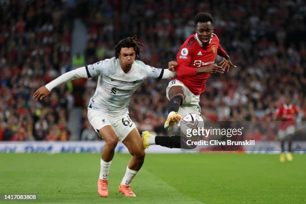 Trent Alexander-Arnold of Liverpool battles for possession with Anthony Elanga of Manchester United during the Premier League match between...