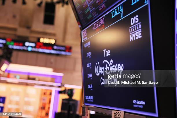 The Walt Disney company logo is displayed as traders work on the floor of the New York Stock Exchange during afternoon trading on August 22, 2022 in...