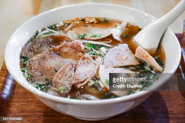 vietnamese rice noodles with beef, pork and luncheon meat toppings - pho soup ストックフォトと画像