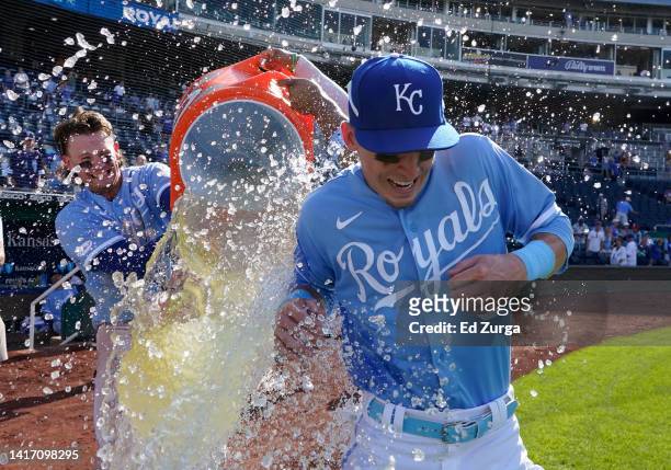 Drew Waters of the Kansas City Royals is doused with water by Bobby Witt Jr. #7 and MJ Melendez as they celebrate a 6-4 win over the Chicago White...