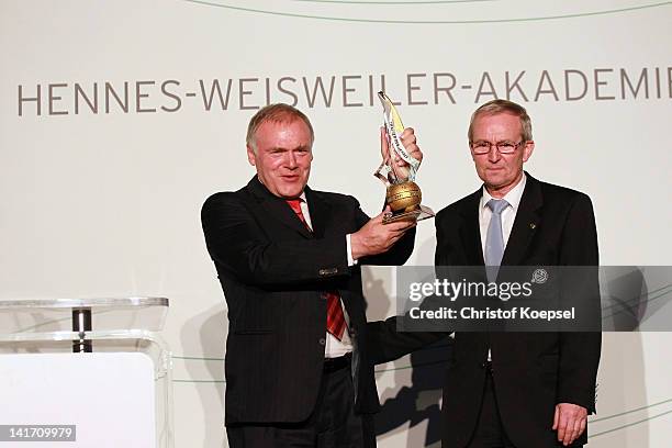Hermann Gerland, assistant coach of FC Bayern Muenchen presents his trophy after being voted as the coach of the year and bein awarded by Reiner...