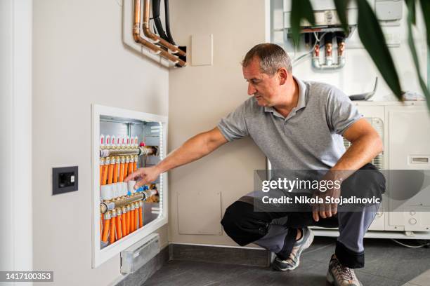 technician checking the pipes' diagnostics - pipefitter stock pictures, royalty-free photos & images