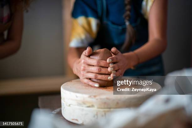 close up to kneading ceramic dough - art class stock pictures, royalty-free photos & images