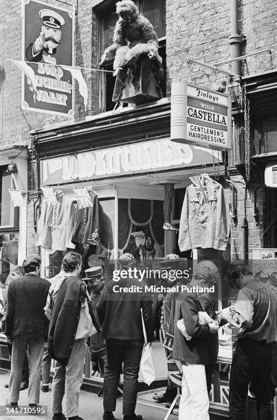 Young men outside the I Was Lord Kitchener's Valet clothing boutique on Carnaby Street, London, July 1967.