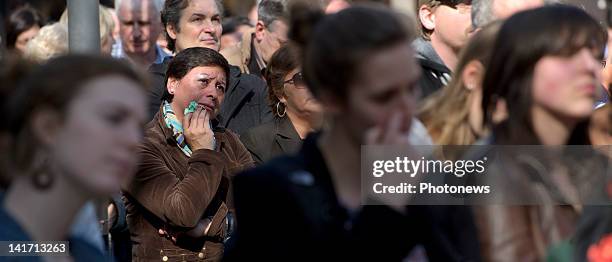 Members of the public stand outside during the funeral ceremony at Saint Peters Church for the seven children from St Lambertius d' Heverlee School...