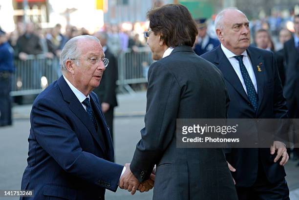 Elio Di Rupo,Prime Minister of Belgium greets King Albert II of Belgium at the funeral ceremony at Saint Peters Church for the seven children from St...