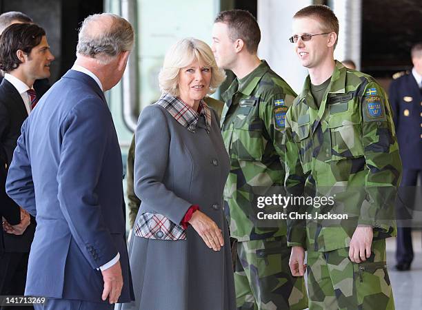 Camilla, Duchess of Cornwall and Prince Charles, Prince of Wales meet military personnel as she arrives at Arlanda Airport on March 22, 2012 in...