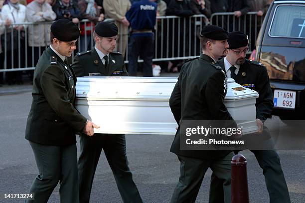 Coffin is carried in to the funeral ceremony at the Saint Peters Church for the seven children from St Lambertius d' Heverlee School who died in the...