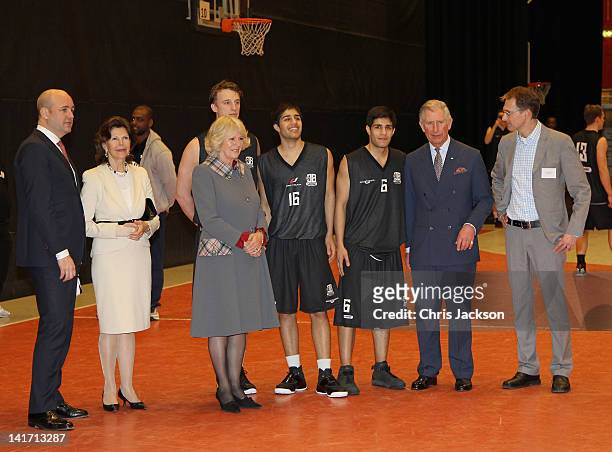 Camilla, Duchess of Cornwall, Prince Charles, Prince of Wales and Queen Silvia of Sweden watch basketball as they visits Fryshuset Youth Centre on...