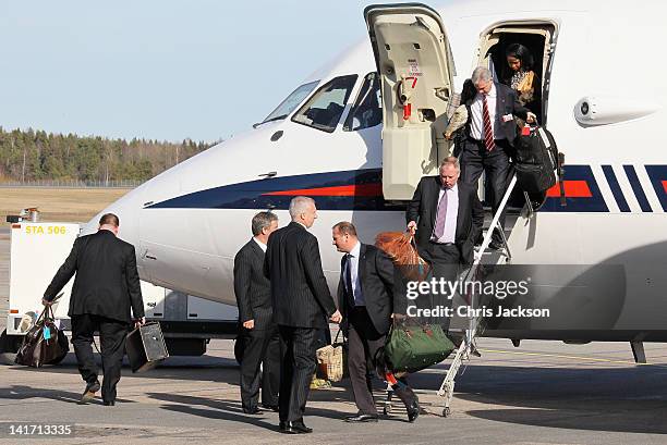 Luggage is unloaded as Camilla, Duchess of Cornwall and Prince Charles, Prince of Wales arrive at Arlanda Airport on March 22, 2012 in Stockholm,...