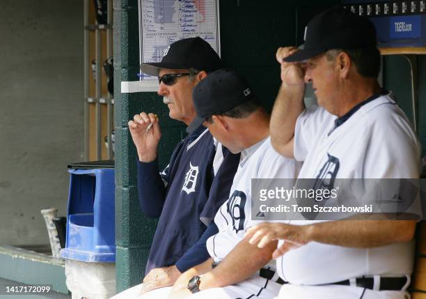 Manager Jim Leyland of the Detroit Tigers smokes a cigarette as he sits in the dugout during MLB game action against the Chicago White Sox at...