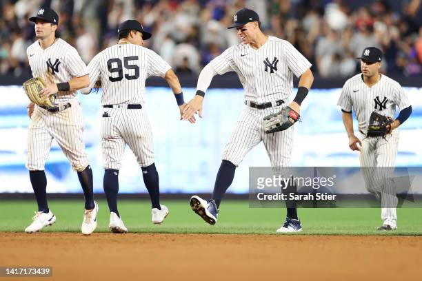Oswaldo Cabrera celebrates with Aaron Judge of the New York Yankees after the ninth inning against the New York Mets at Yankee Stadium on August 22,...