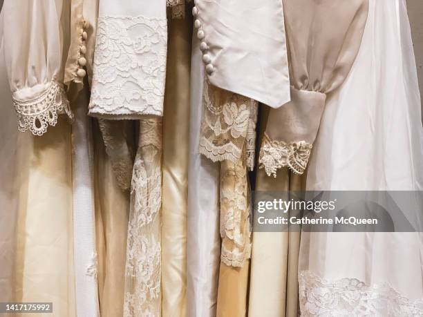 rack of vintage wedding dresses - silk garment stock pictures, royalty-free photos & images