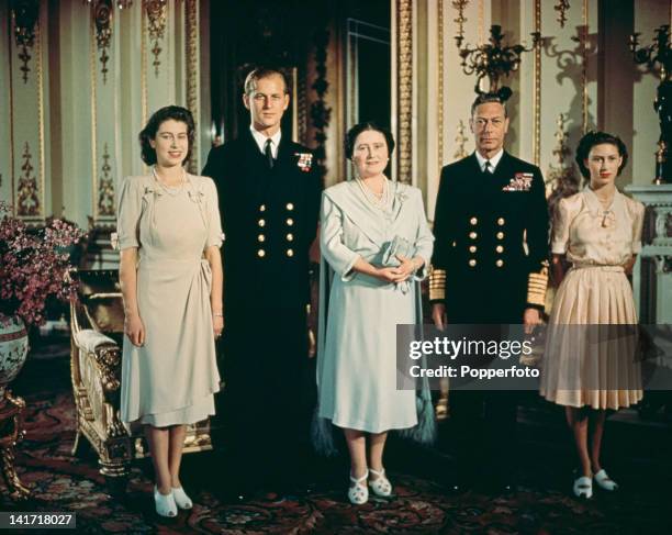 Portrait of the British royal family in the state apartments at Buckingham Palace to mark the engagement of Princess Elizabeth and Philip Mountbatten...