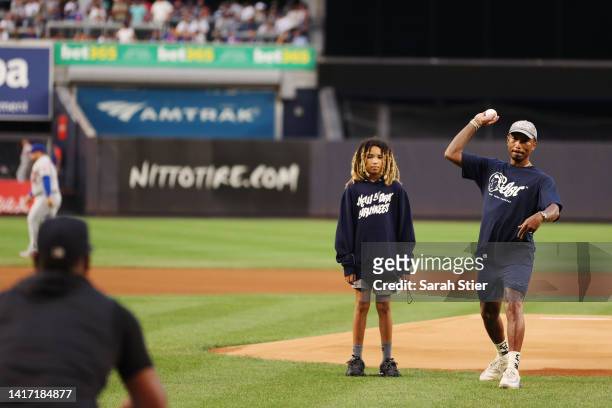 Musician Pharrell Williams throws a ceremonial first pitcher to Luis Severino of the New York Yankees before the first inning against the New York...