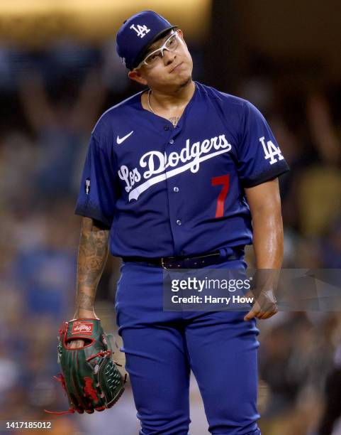 Julio Urias of the Los Angeles Dodgers reacts to a solo homerun from Luis Urias of the Milwaukee Brewers, to take a 1-0 lead, during the fourth...