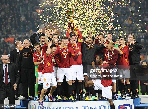Roma players celebrate after the Juvenile TIM Cup Final match between AS Roma and Juventus FC at Stadio Olimpico on March 22, 2012 in Rome, Italy.