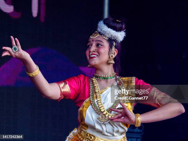 dancer performing at the aberdeen mela one-world day event - mela stock pictures, royalty-free photos & images