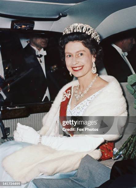 Queen Elizabeth II leaves Schloss Augustusburg in Bruhl, Germany, after attending a State Reception, May 1965. She is wearing the Jubilee Necklace...