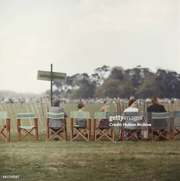 Queen Elizabeth II with Prince Charles and Princess Anne at Smith's Lawn in Windsor Great Park, 1958.