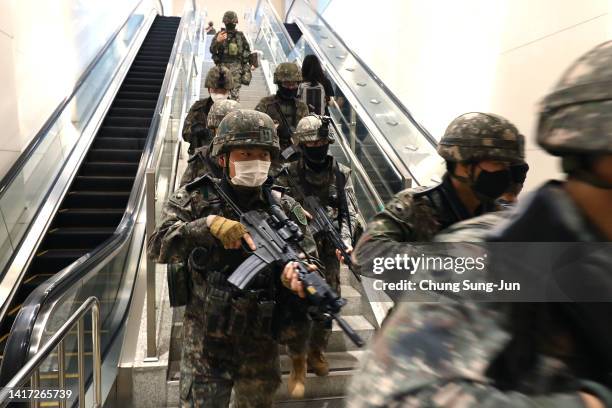 South Korean soldiers participate in an anti-terror and anti-chemical terror exercise as part of the 2022 Ulchi Freedom Shield at Lotte shopping mall...