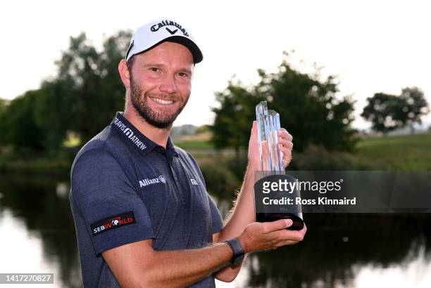 Maximilian Kieffer of Germany poses with the winners trophy after the final of the D+D Real Czech Masters at Albatross Golf Resort on August 21, 2022...