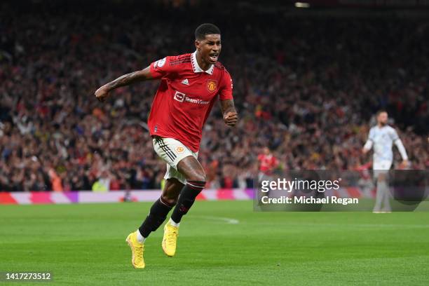 Marcus Rashford of Manchester United celebrates scoring a goal to make it 2-0 during the Premier League match between Manchester United and Liverpool...