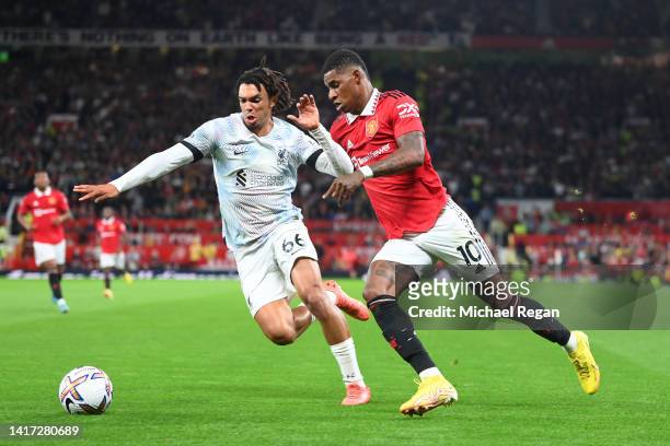Marcus Rashford of Manchester United in action with Trent Alexander-Arnold of Liverpool during the Premier League match between Manchester United and...