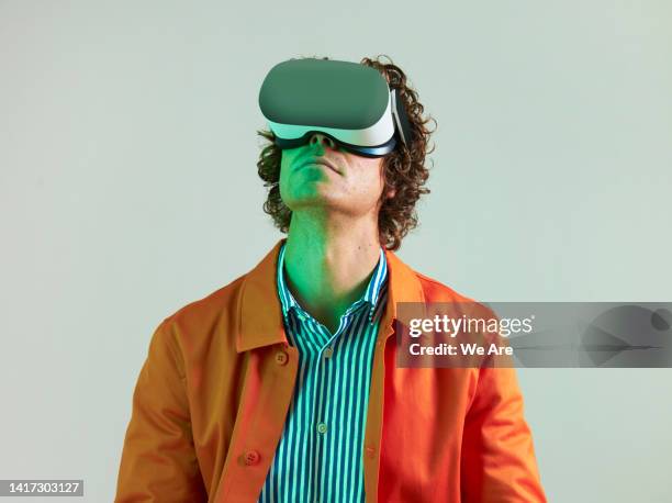 man using virtual reality headset - wearable ストックフォトと画像