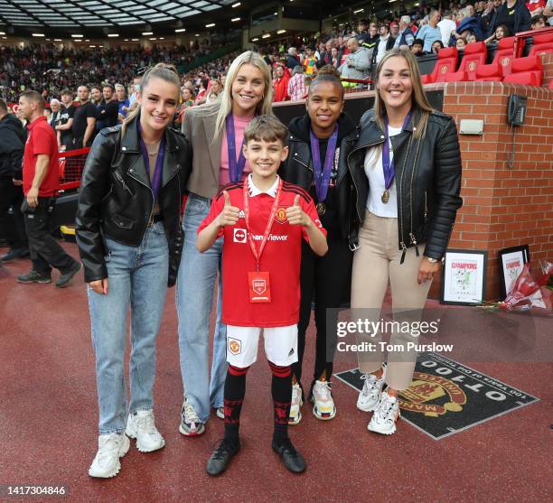 Euro 2022 Champions Mary Earps, Ella Toone and Alessia Russo and Nikita Paris of Manchester United and England Women are presented to the crowd ahead...