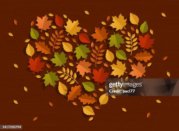 paper autumn leaves heart shape. - september background stock illustrations