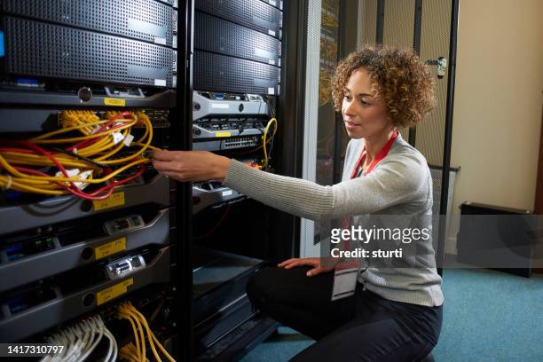 patching cables in server room - data centre stock pictures, royalty-free photos & images