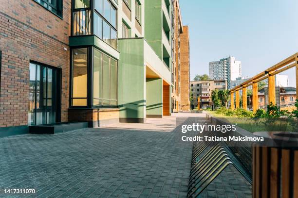 modern courtyard of a multi-storey building. sunny summer day. - modern school stock pictures, royalty-free photos & images