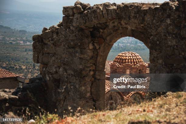 the city of mystras seen through a ruined gate, laconia, peloponnese, greece. - paul of greece - fotografias e filmes do acervo