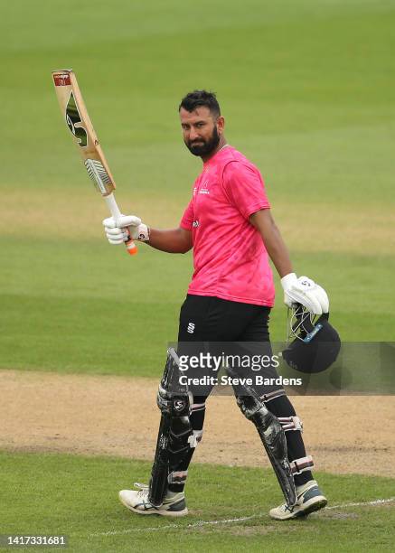 Cheteshwar Pujara of Sussex Sharks acknowledges the crowd after reaching his century during the Royal London Cup match between Sussex Sharks and...