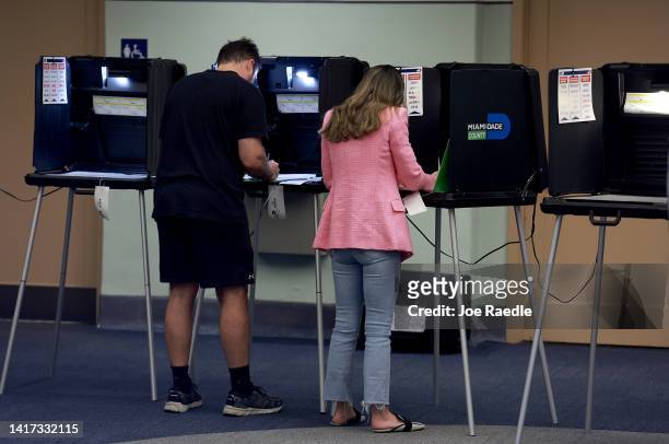Voters fill out their ballots at a polling station on August 23, 2022 in Miami Beach, Florida. Voters across the state cast their ballots during the...