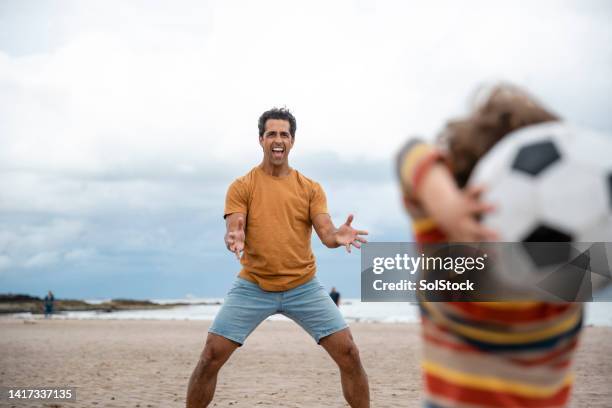 throwing a ball to dad - playing catch stock pictures, royalty-free photos & images