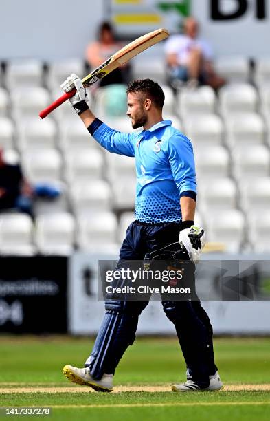 Lewis McManus of Northamptonshire celebtares reaching his century during the Royal London One Day Cup match between Northamptonshire Steelbacks and...