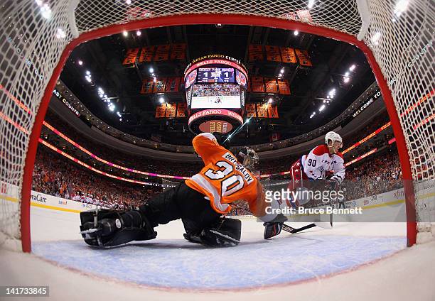 Ilya Bryzgalov of the Philadelphia Flyers stops Marcus Johansson of the Washington Capitals on a second period penalty shot at the Wells Fargo Center...