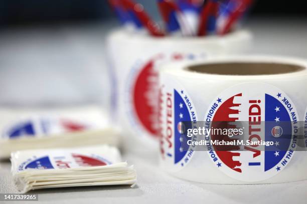 Voting stickers are seen during Primary Election Day at PS 130 on August 23, 2022 in the Windsor Terrace neighborhood of Brooklyn borough in New York...