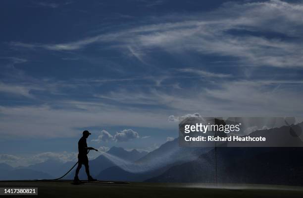 Greenskeeper waters the 7th green prior to the Omega European Masters at Crans-sur-Sierre Golf Club on August 23, 2022 in Crans-Montana, Switzerland.