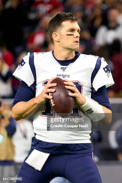 Tom Brady of the New England Patriots warms up before an NFL football game against the Houston Texans, Sunday, Dec. 1 in Houston.