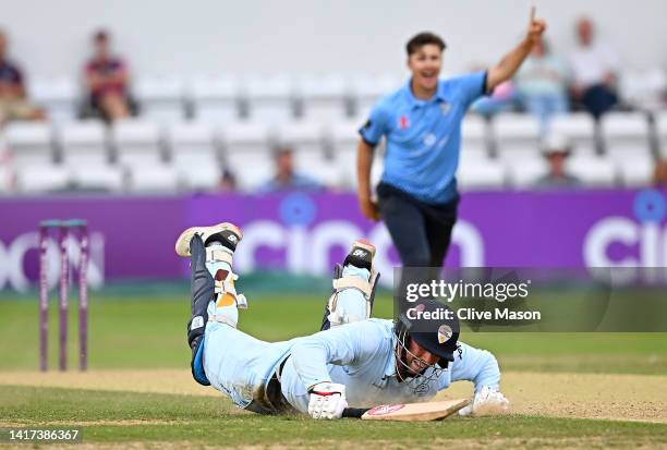 Billy Godleman of Derbyshire is run out by Ricardo Vasconcelos of Northamptonshire off the bowling of James Sales of Northamptonshire during the...