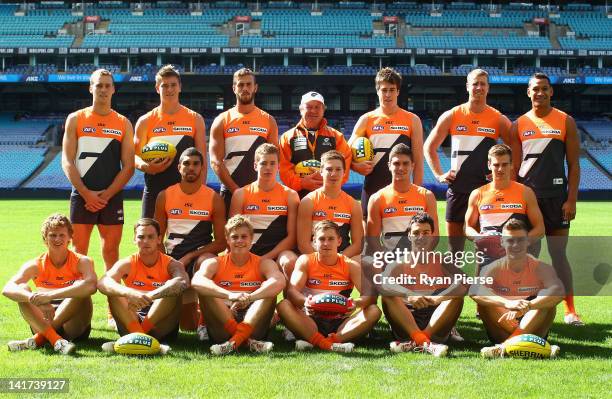 Kevin Sheedy, coach of the Giants, poses with the 17 Giants first game players during a Greater Western Sydney Giants AFL training session at ANZ...