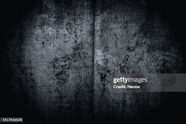dark vignette image of a cement wall - vignettering stockfoto's en -beelden