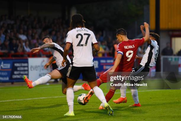 Tom Nichols of Crawley Town scores their team's first goal during the Carabao Cup Second Round match between Crawley Town and Fulham at Broadfield...