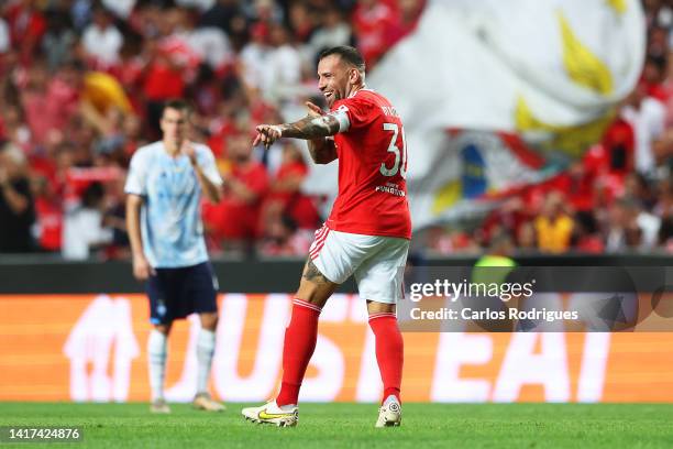 Nicolas Otamendi of Benfica celebrates after scoring their side's first goal during the UEFA Champions League Play-Off Second Leg match between SL...