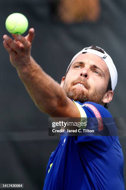 Joao Sousa of Portugal prepares to serve to Laslo Djere of Serbia during their second round match on day four of the Winston-Salem Open at Wake...