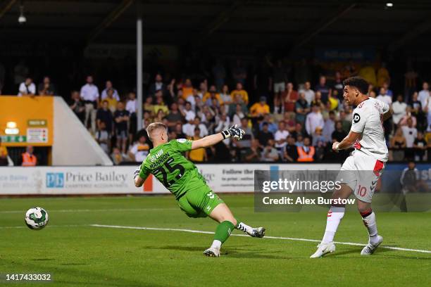 Che Adams of Southampton scores their side's second goal during the Carabao Cup Second Round match between Cambridge United and Southampton at Abbey...