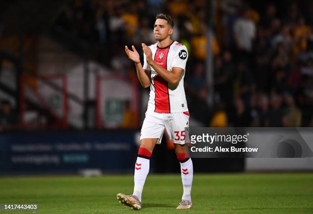 Jan Bednarek of Southampton applauds fans after the Carabao Cup Second Round match between Cambridge United and Southampton at Abbey Stadium on...